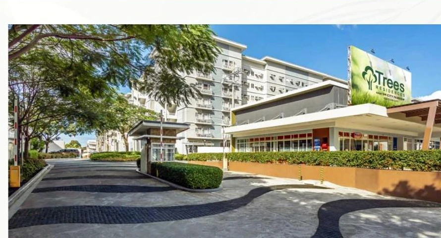 Trees Residences landscaped entrance and retail strip